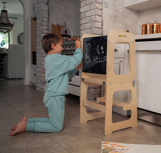 Discover the 4-in-1 Kitchen Tower for Toddlers - Chalkboard, Desk, Table & Chair! Perfect for Ages 18 Months to 6 Years